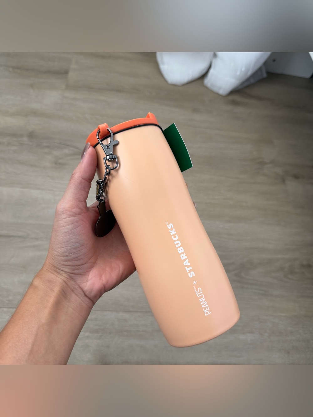 Starbucks and Peanuts 16-ounce tumbler with Woodstock charm